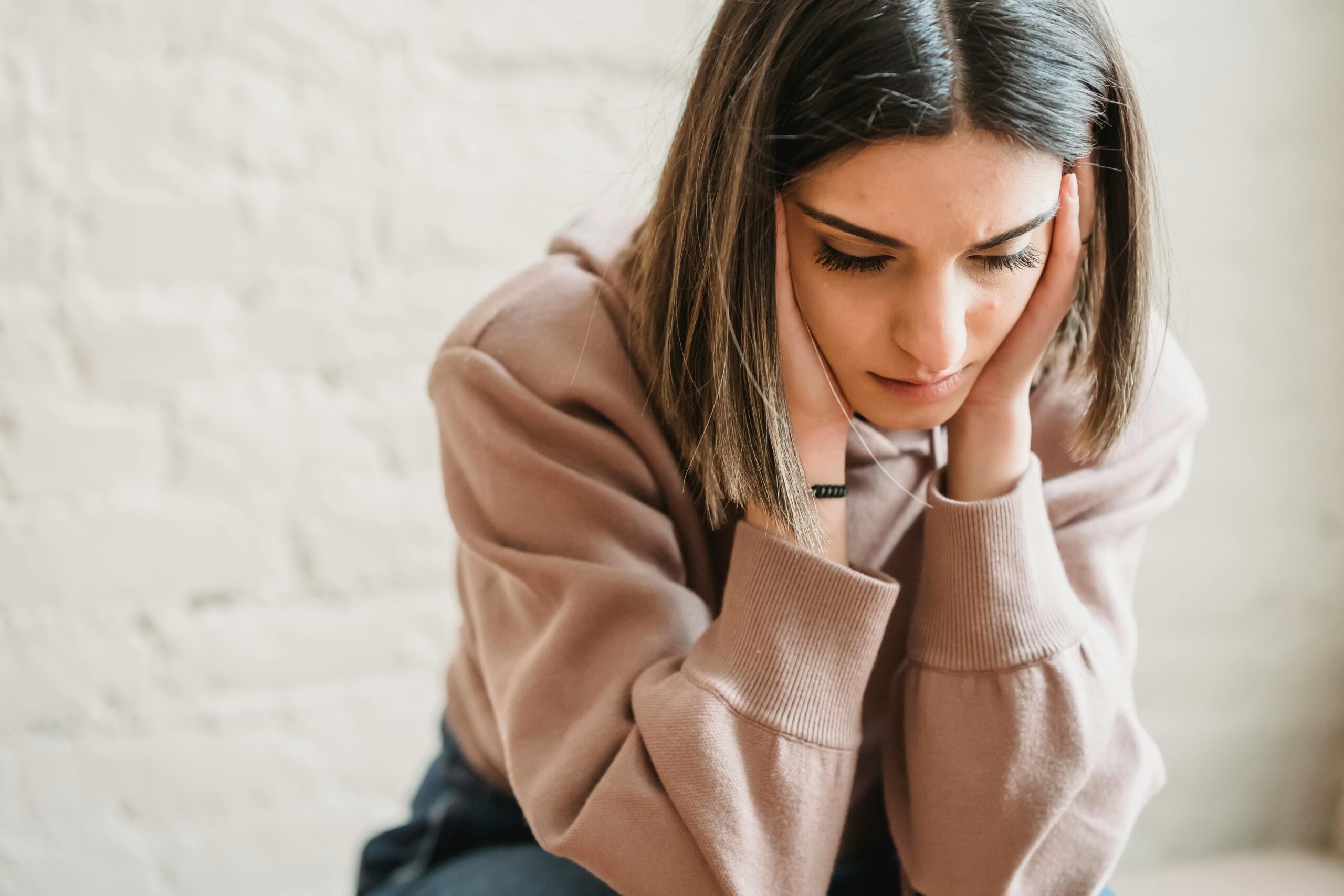 Frustrated woman experiencing gut and brain fog